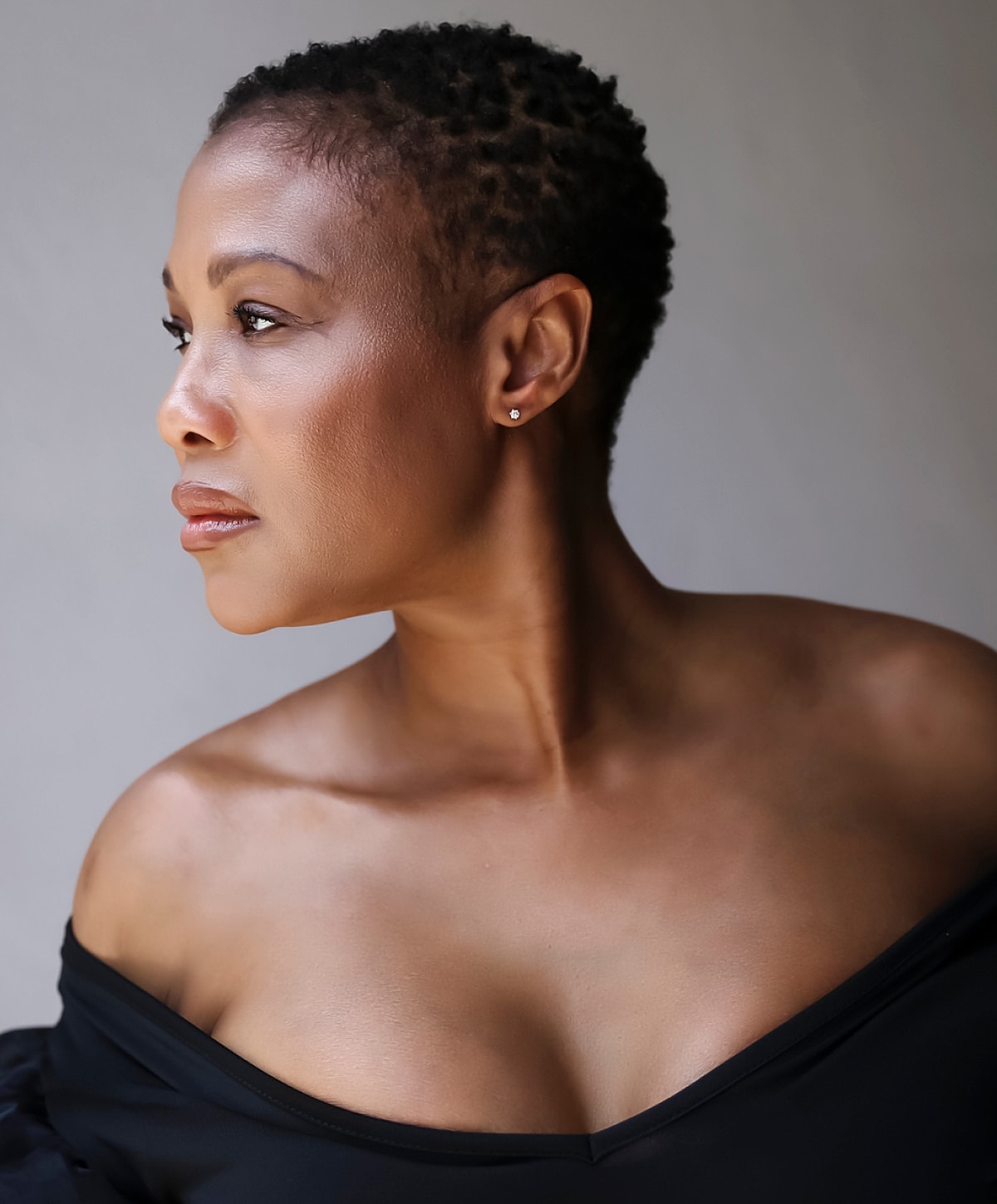 Profile of a woman with short hair.