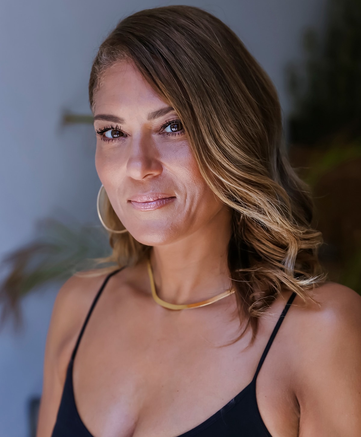 Model posing in a casual white outfit.