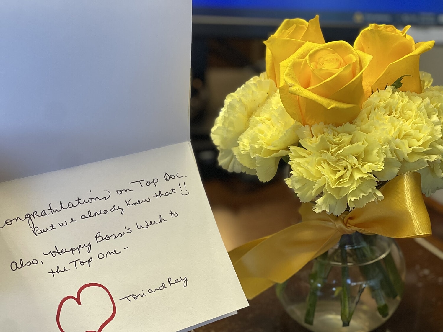 Woman holding magazine in stylish dress.
