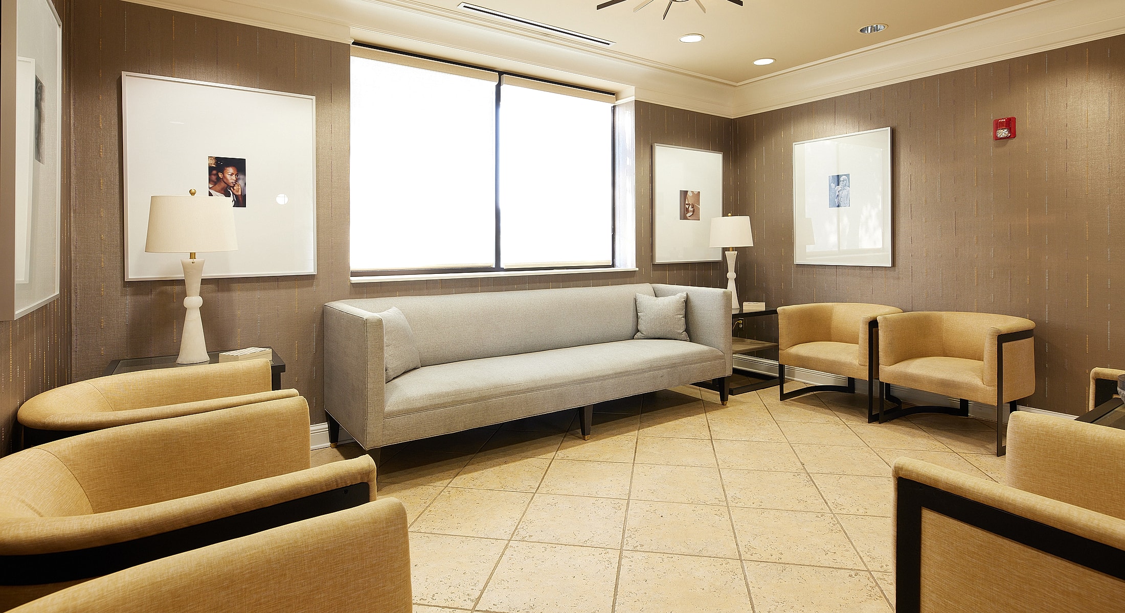 Modern waiting area with seating and artwork.